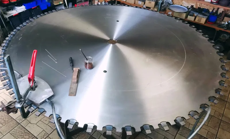 Very large diamond segmented saw blade on a table in the workshop